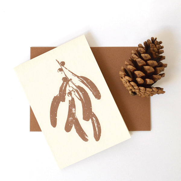 letterpress christmas card with mistletoe