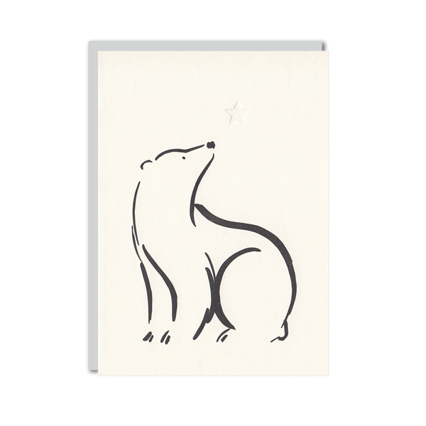 Letterpress christmas card featuring a bear and a star