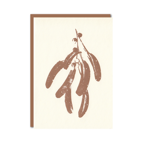 Letterpress christmas card featuring copper mistletoe