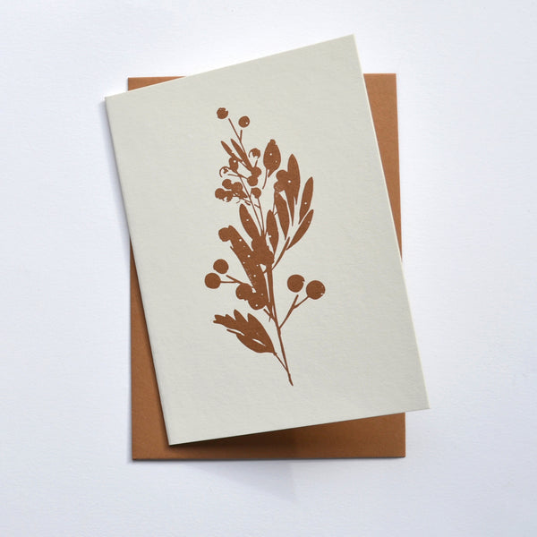 Letterpress christmas card featuring a stem of berries 